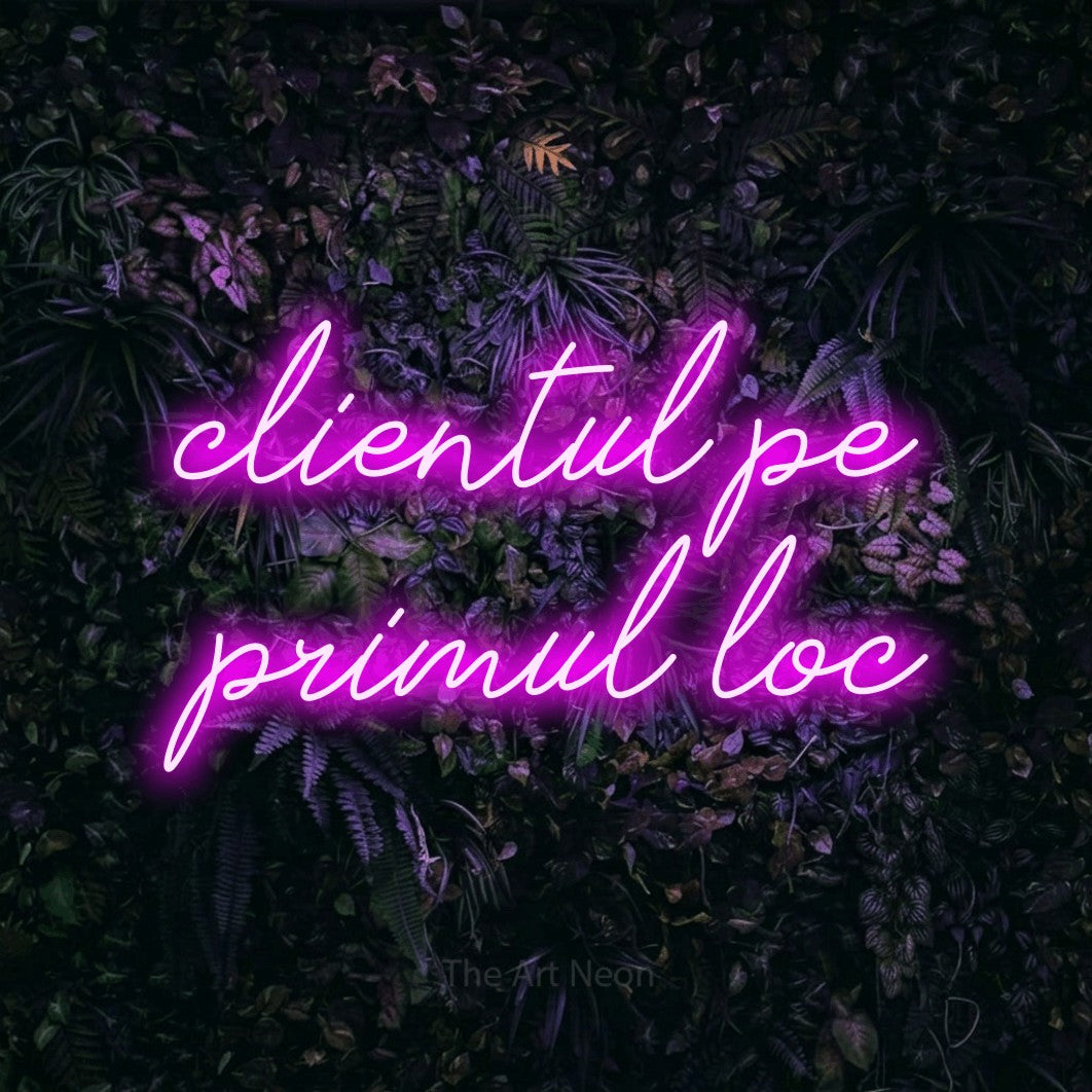 LED neon sign reading “clientul pe primul loc”, arranged in two lines.