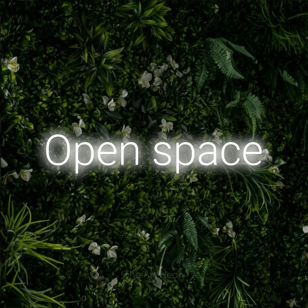 LED neon sign reading “Open space”, arranged in a single line.
