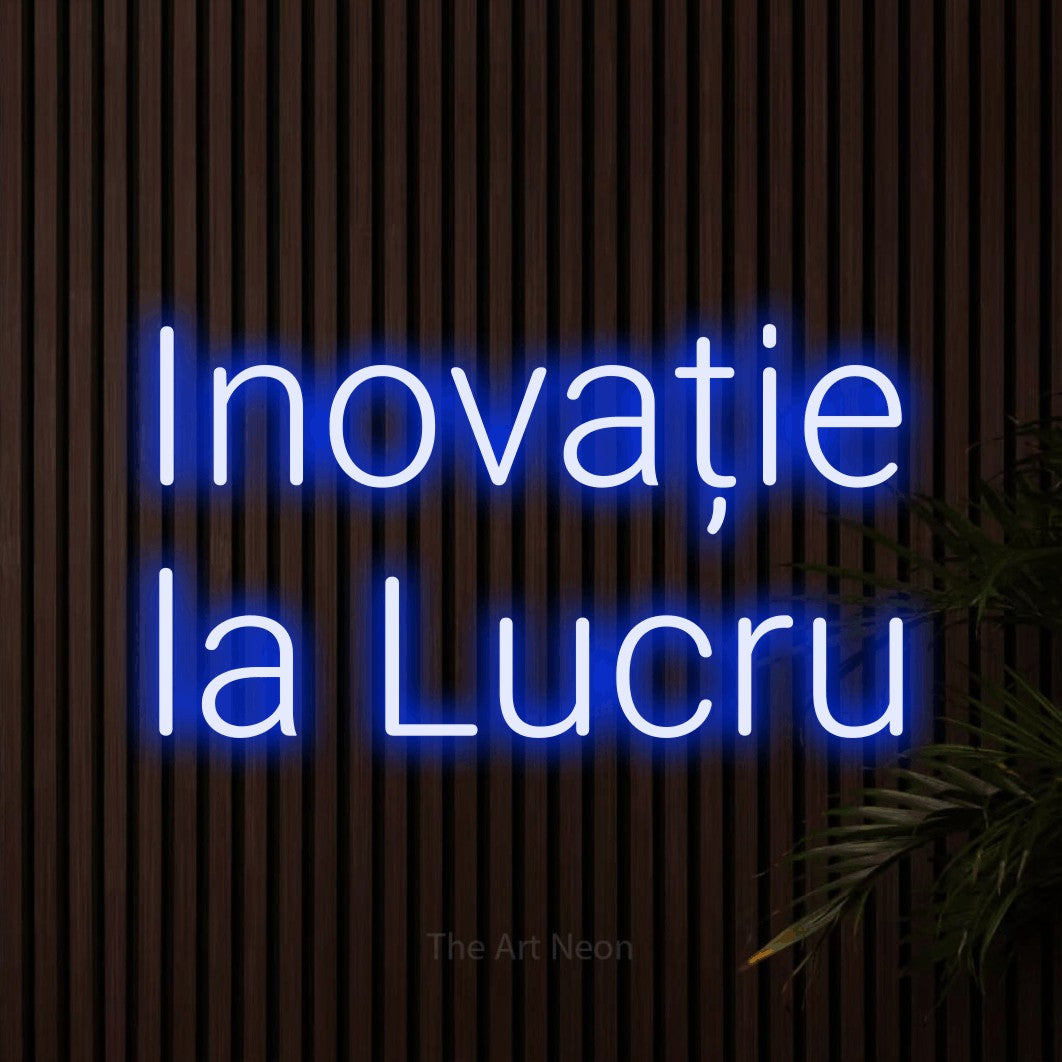 LED neon sign reading “Inovație la Lucru”, arranged in two lines.