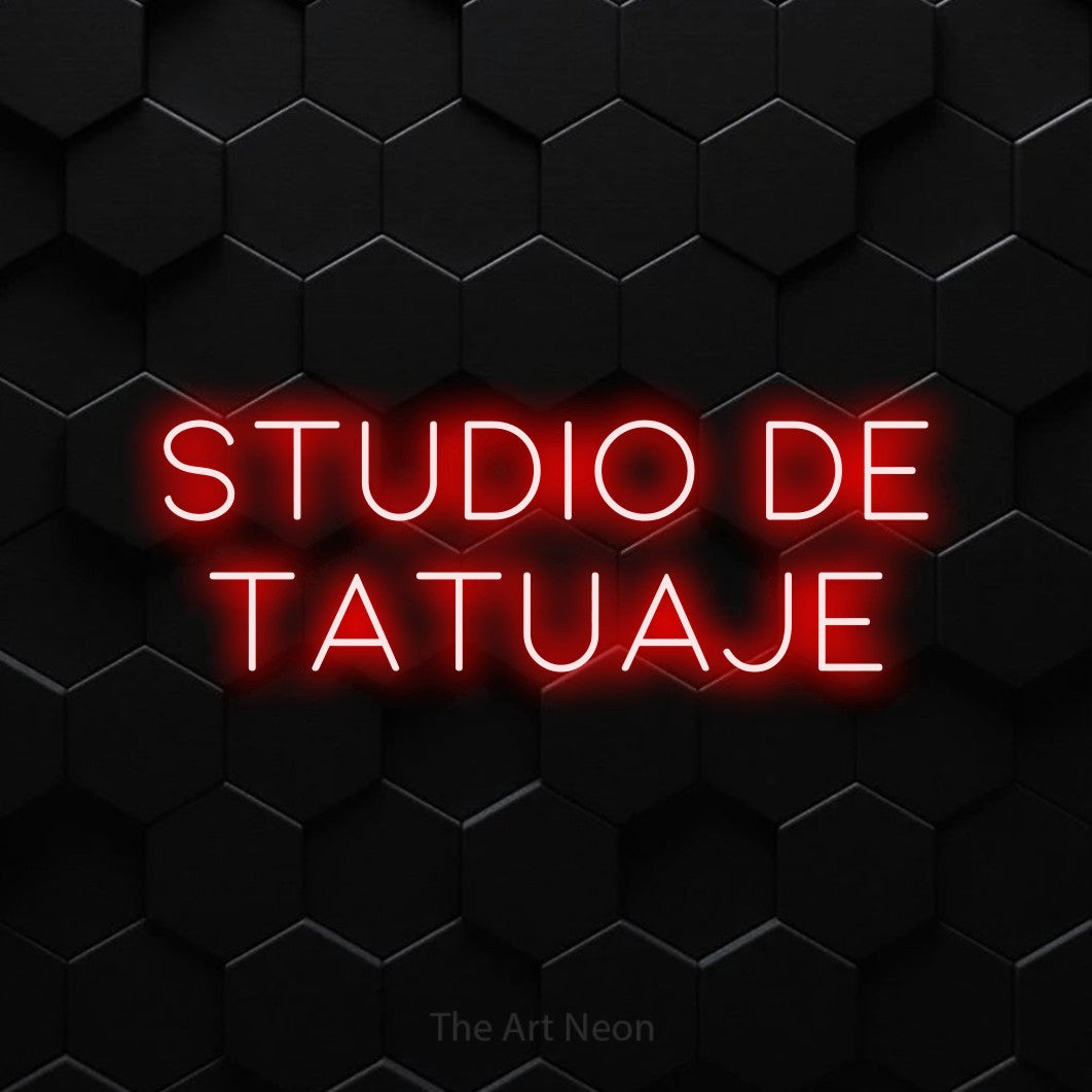 LED neon sign reading “Studio de Tatuaje”, arranged in two lines.