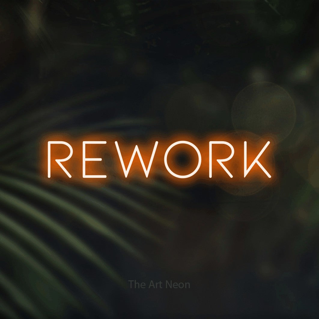LED neon sign reading “Rework”, arranged in a single line.