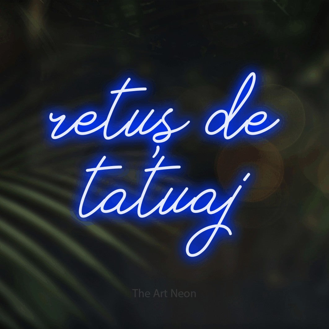 LED neon sign reading “retuș de tatuaj”, arranged in two lines.