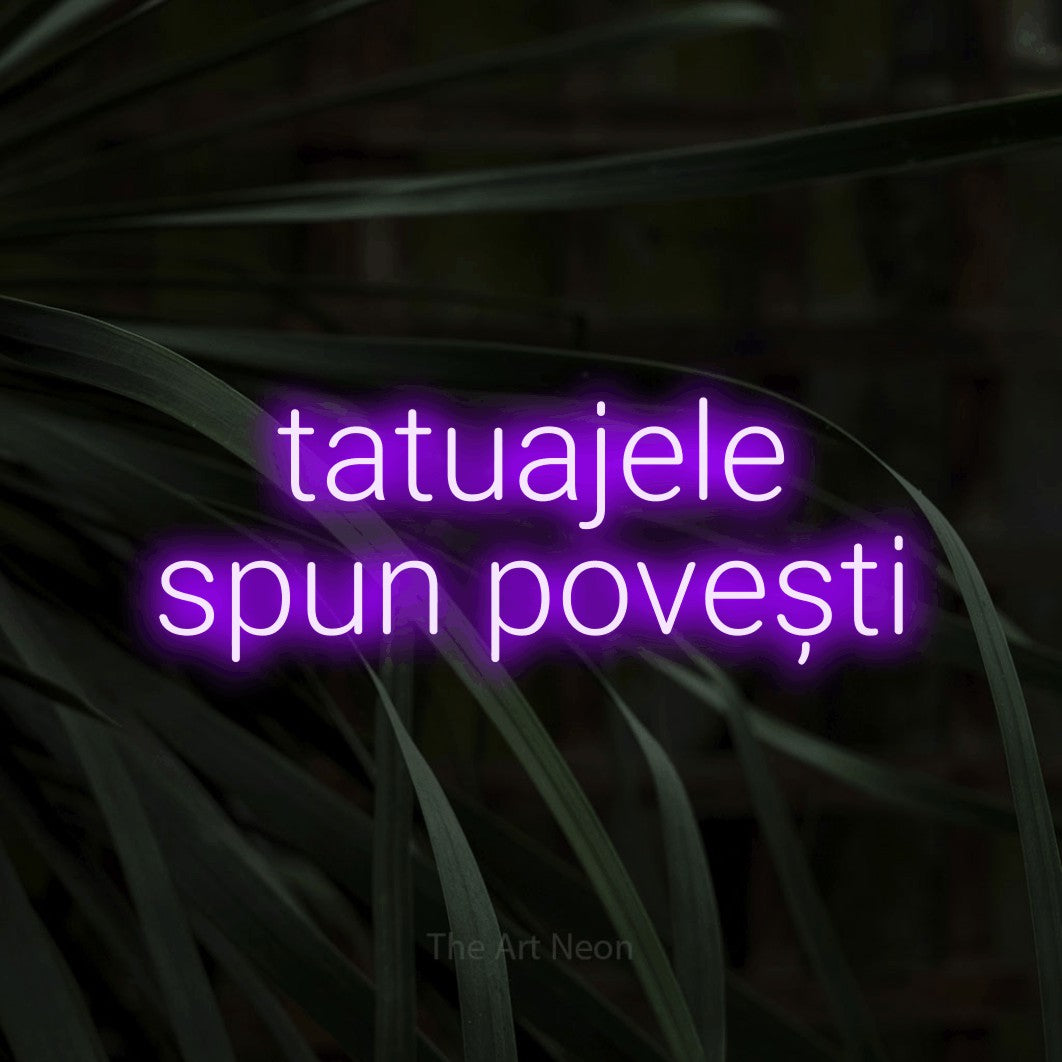 LED neon sign reading “tatuajele spun povești”, arranged in two lines.