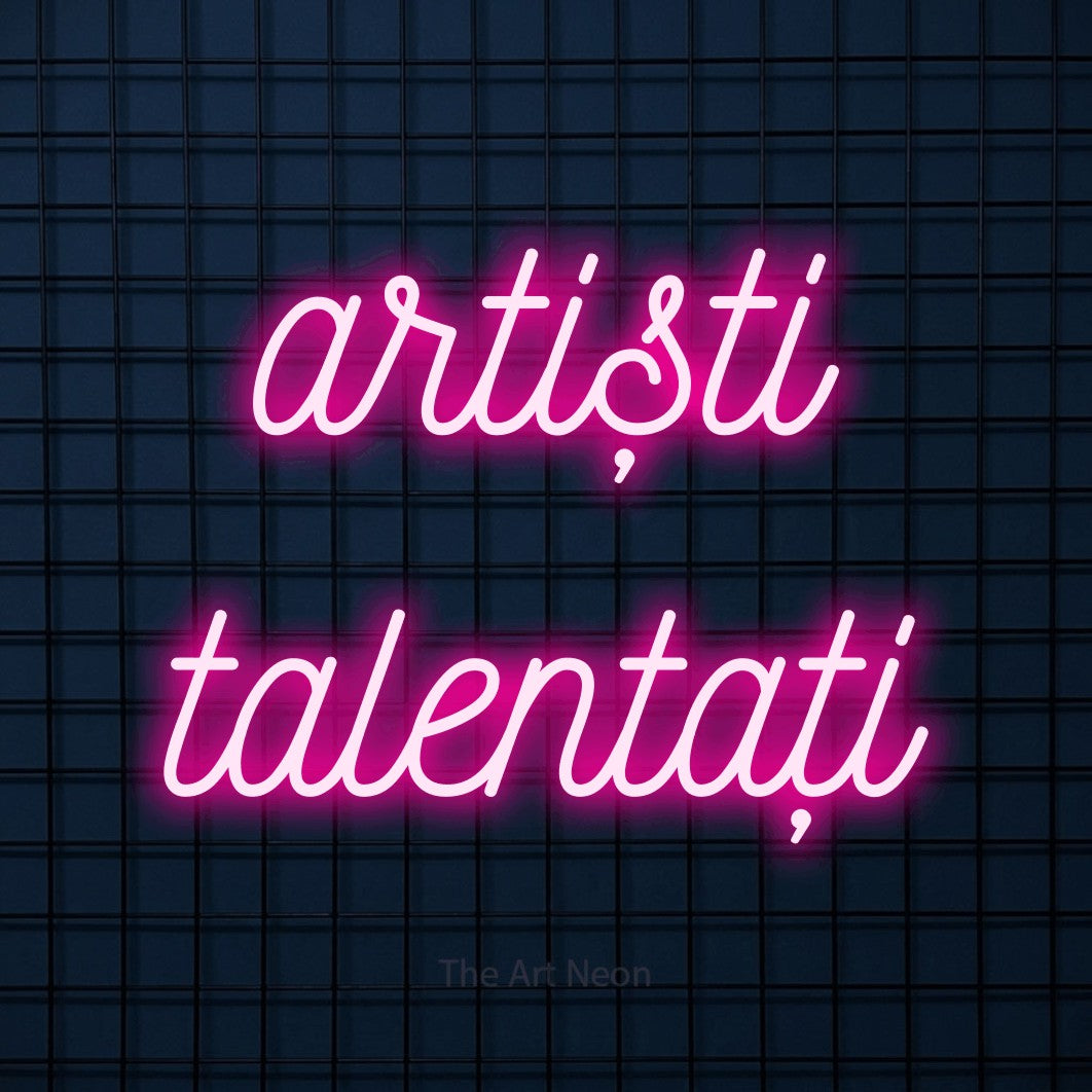 LED neon sign reading “artiști talentați”, arranged in two lines.