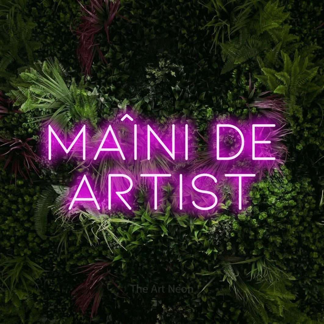 LED neon sign reading “Mâini de Artist”, arranged in two lines.