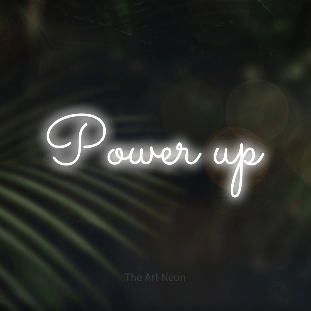 LED neon sign reading “Power up”, arranged in a single line.