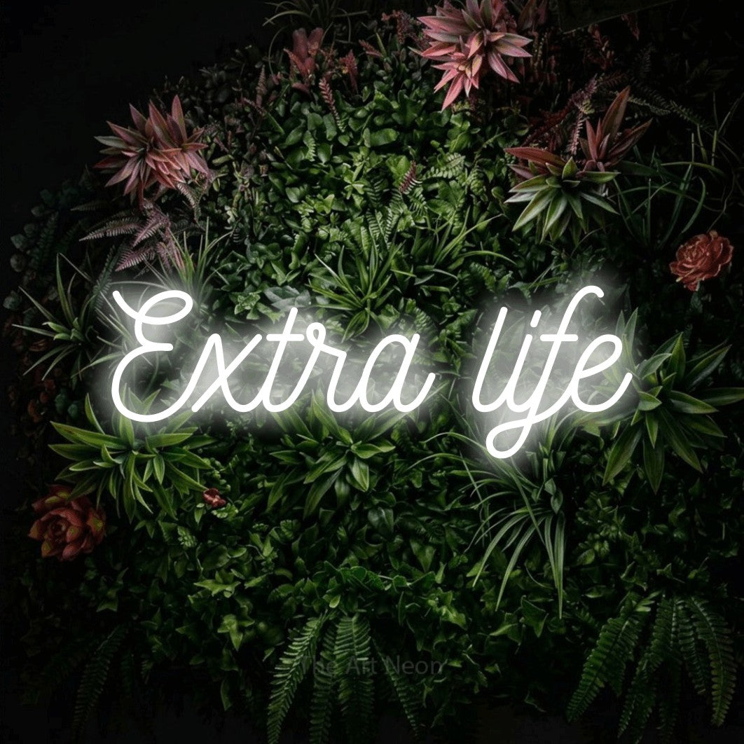 LED neon sign reading “Extra life”, arranged in a single line.