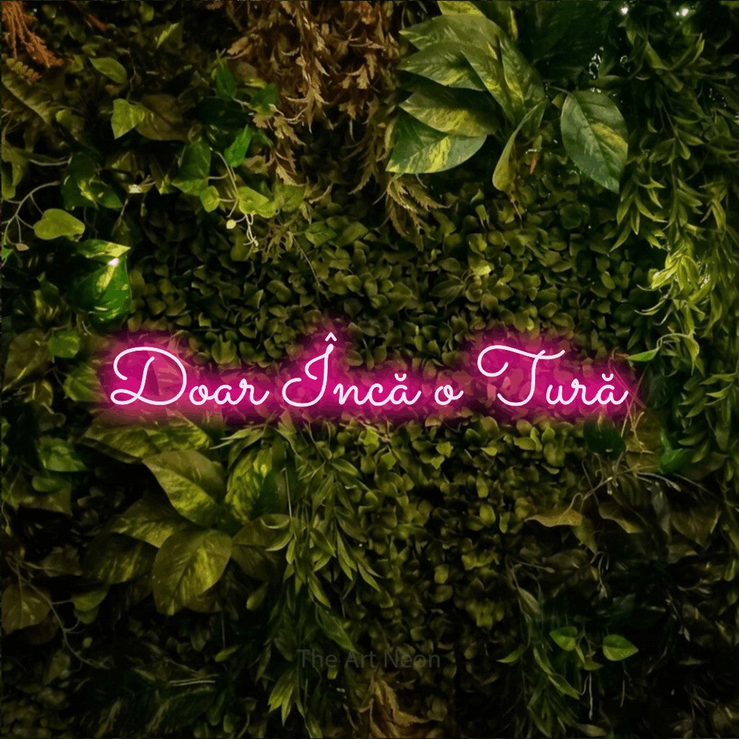 LED neon sign reading “Doar Încă o Tură”, arranged in a single line.