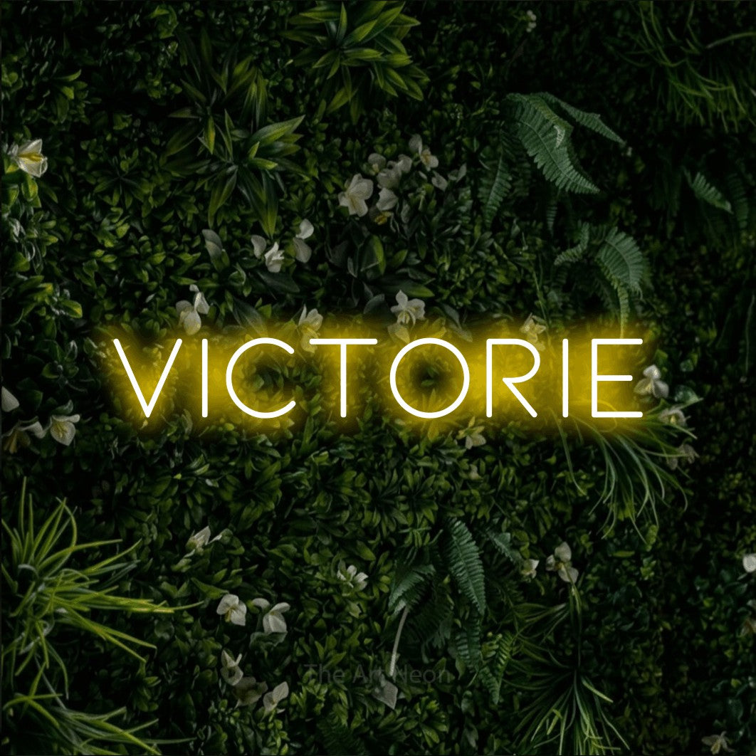 LED neon sign reading “Victorie”, arranged in a single line.