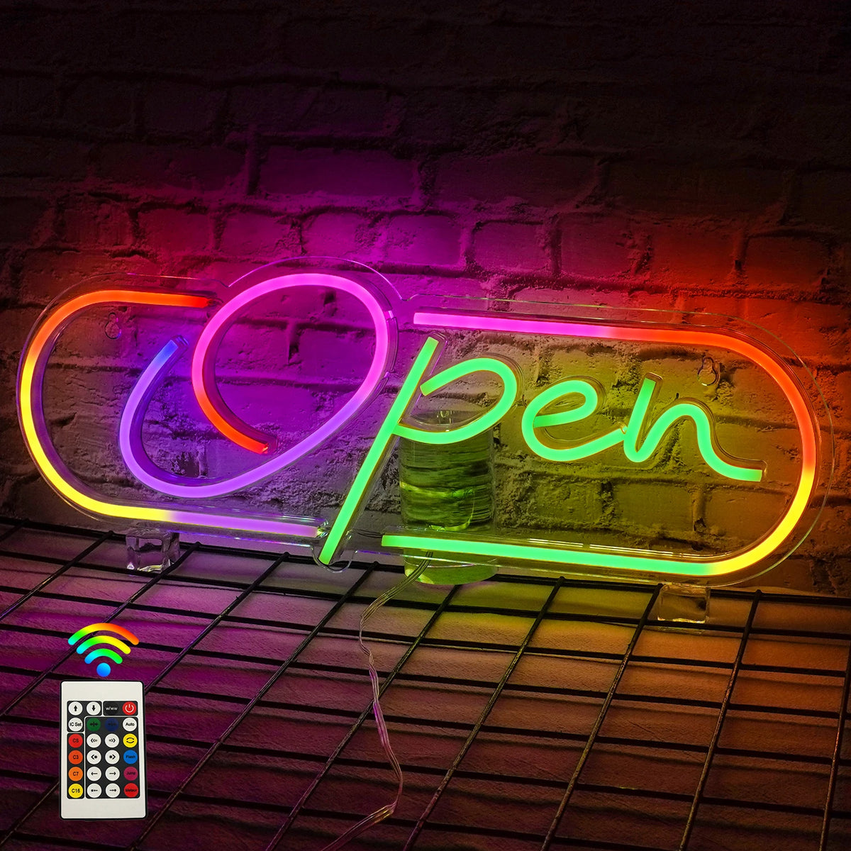 L'image montre un panneau néon LED vibrant avec le mot « Open » en lettres grasses et colorées.