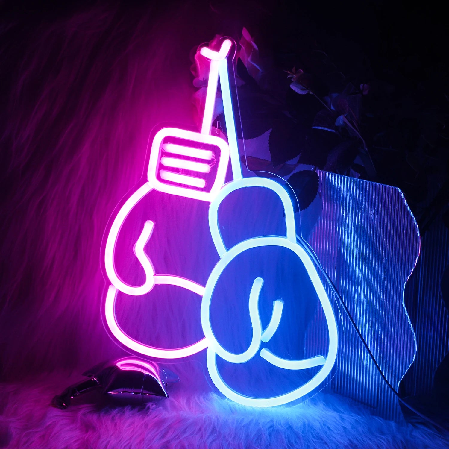 The image features a vibrant, handmade LED neon sign in the shape of boxing gloves.