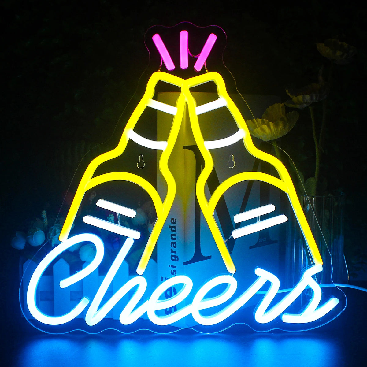 Élénk LED-es neonreklám, amelyen a „Cheers” szó látható kurzív szkriptben.