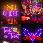 A képen egy élénk LED-neonreklám látható, amelyen a „Trick or Treat” felirat látható játékos, stilizált betűkkel.