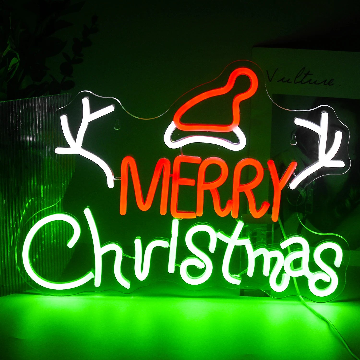 A vibrant LED neon sign displaying the word "Christmas" in stylish, cursive lettering.