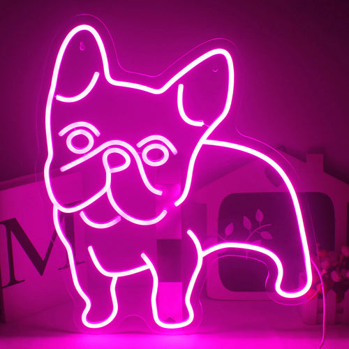 La imagen presenta un letrero de neón LED de color rosa vibrante con la forma del contorno de un perro.