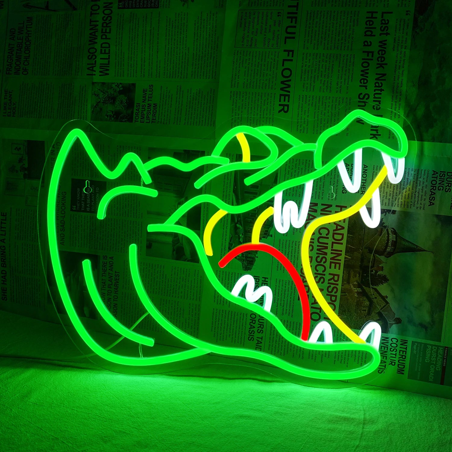 Das Bild zeigt ein leuchtendes LED-Neonschild in Form eines Alligators.
