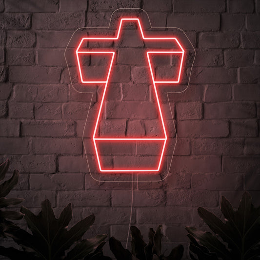An illuminated neon sign featuring a sacred cross