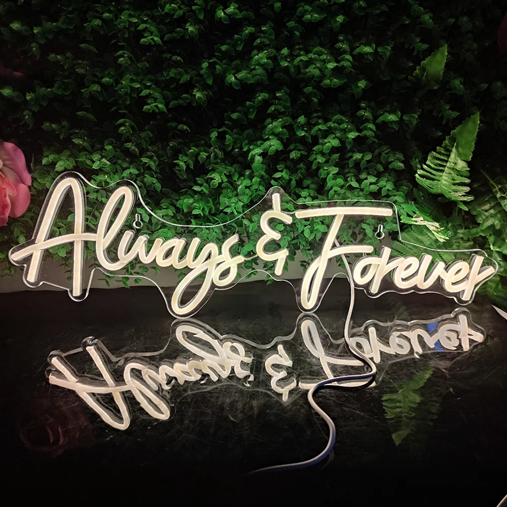 L'immagine presenta un'insegna al neon a LED luminosa che riporta la scritta "Always Forever" in un elegante carattere corsivo.
