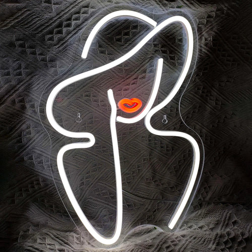 Na zdjęciu widoczny jest przyciągający wzrok i stylowy neon LED w kształcie sylwetki kobiety.