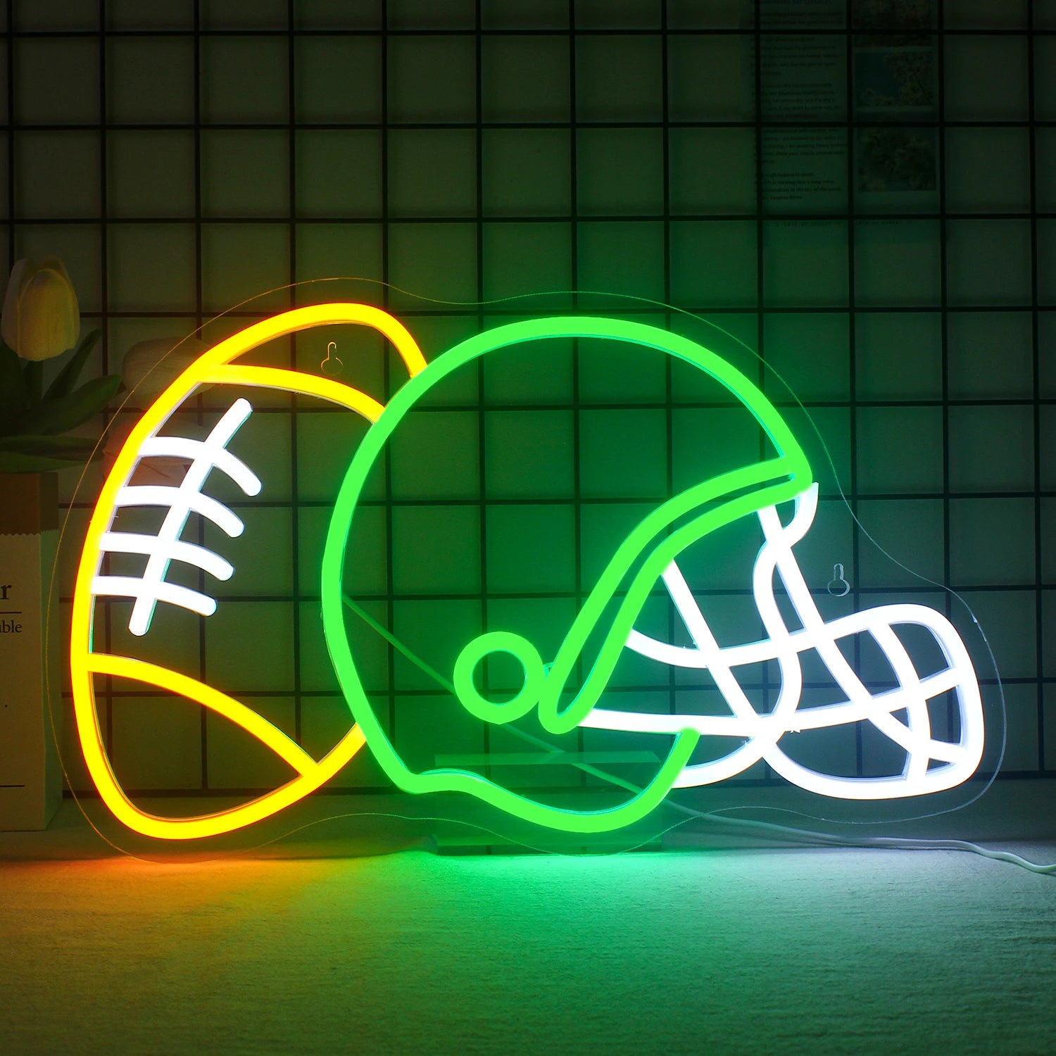 The image features a vibrant LED neon sign in the shape of a rugby helmet.