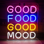 Elav LED-neoonsilt, millel on mängulises kursiivses kirjas sõnad "Good Food Good Mood".