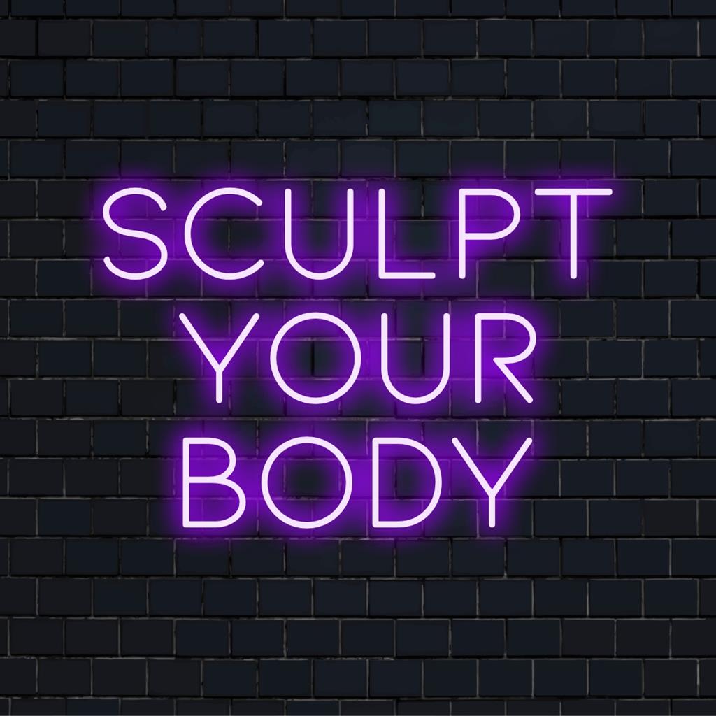 Custom LED neon sign with the motivational phrase 'Sculpt Your Body' glowing in vibrant hues, inspiring fitness-focused decor.