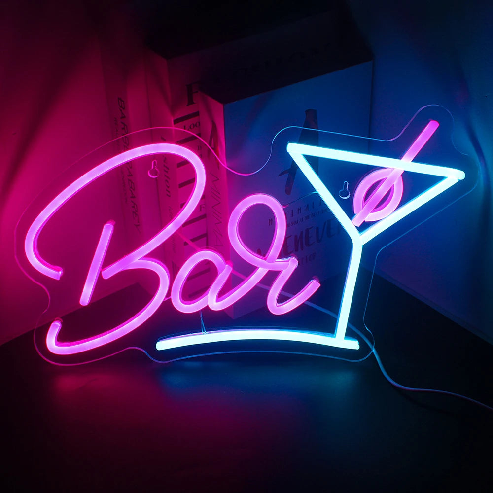 L'image montre un panneau néon LED vibrant représentant un verre à vin stylisé.