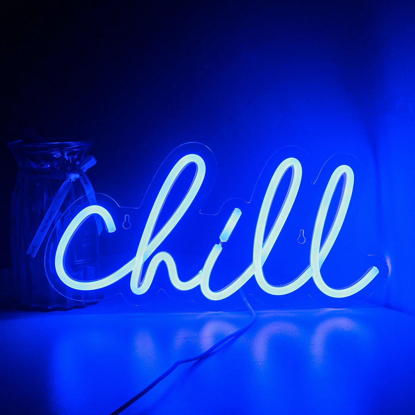 The image displays a "Chill" LED neon sign, featuring the word "Chill" written in a vibrant, cursive style.