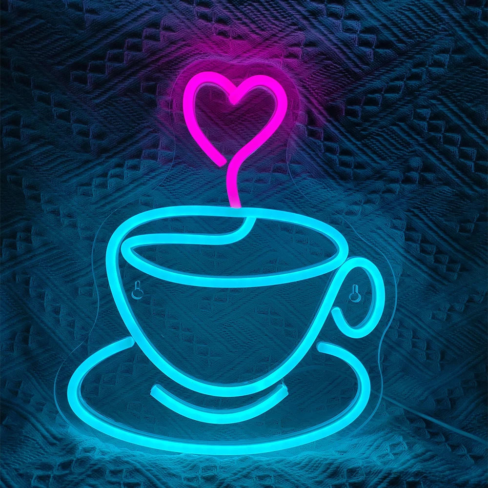 A vibrant LED neon sign shaped like a coffee cup with steam, accompanied by a heart symbol above.