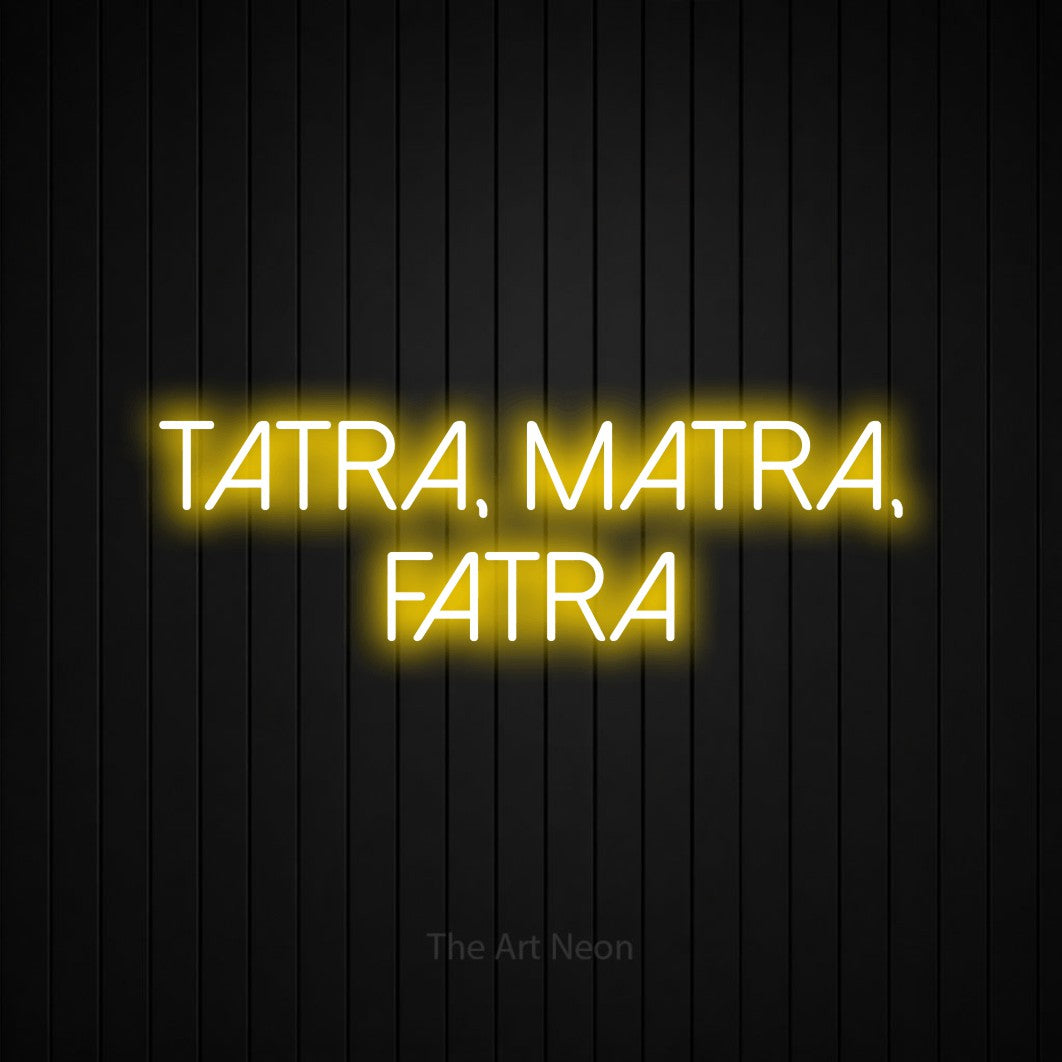 LED neon sign reading “TATRA, MATRA, FATRA”, arranged in two lines.