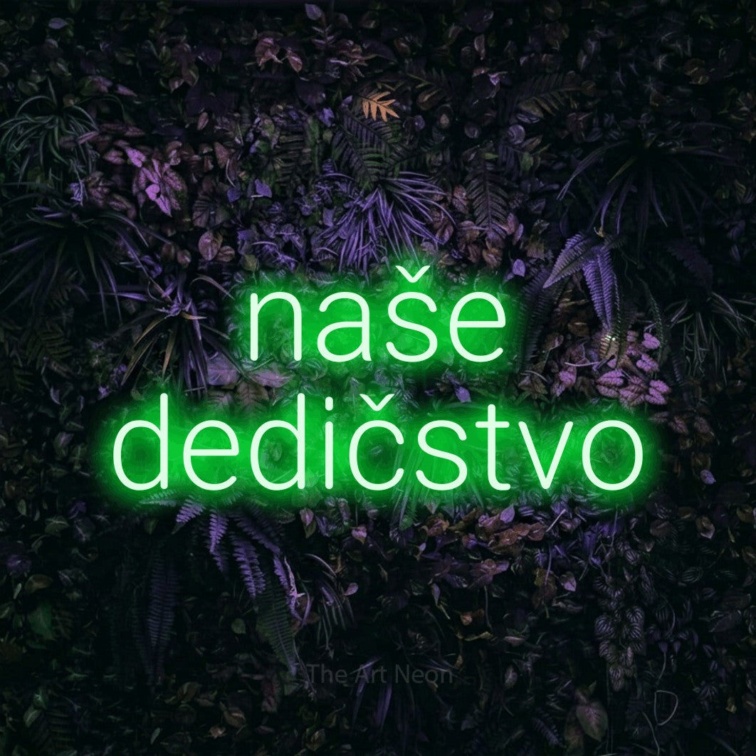LED neon sign reading “naše dedičstvo”, arranged in two lines.