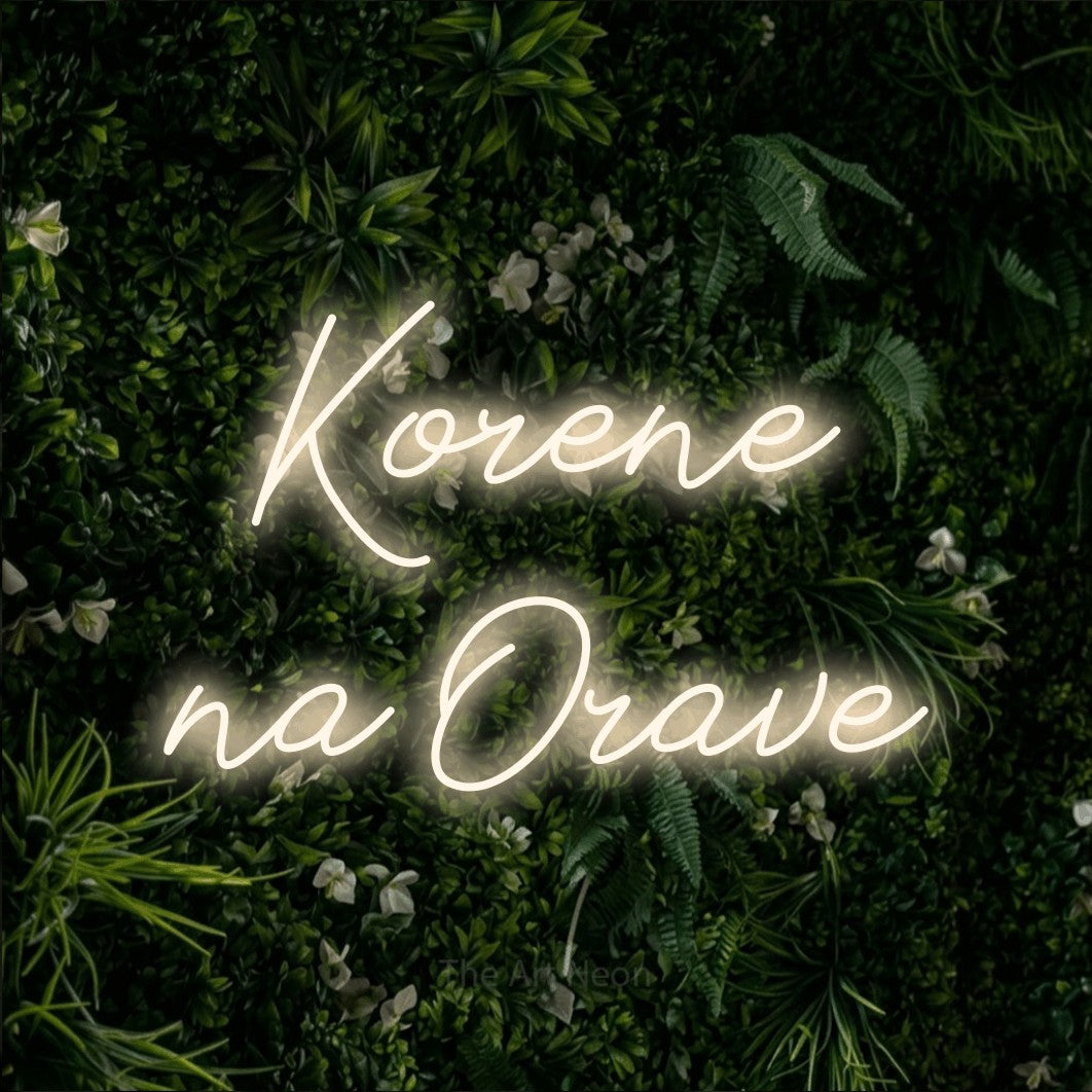 LED neon sign reading “Korene na Orave”, arranged in two lines.