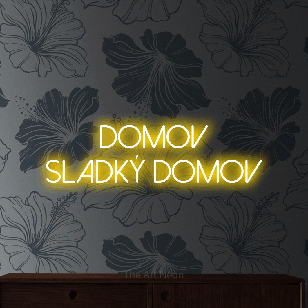 LED neon sign reading “DOMOV SLADKÝ DOMOV”, arranged in two lines.