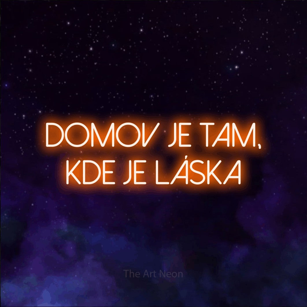 LED neon sign reading “domov je tam, kde je láska”, arranged in two lines.
