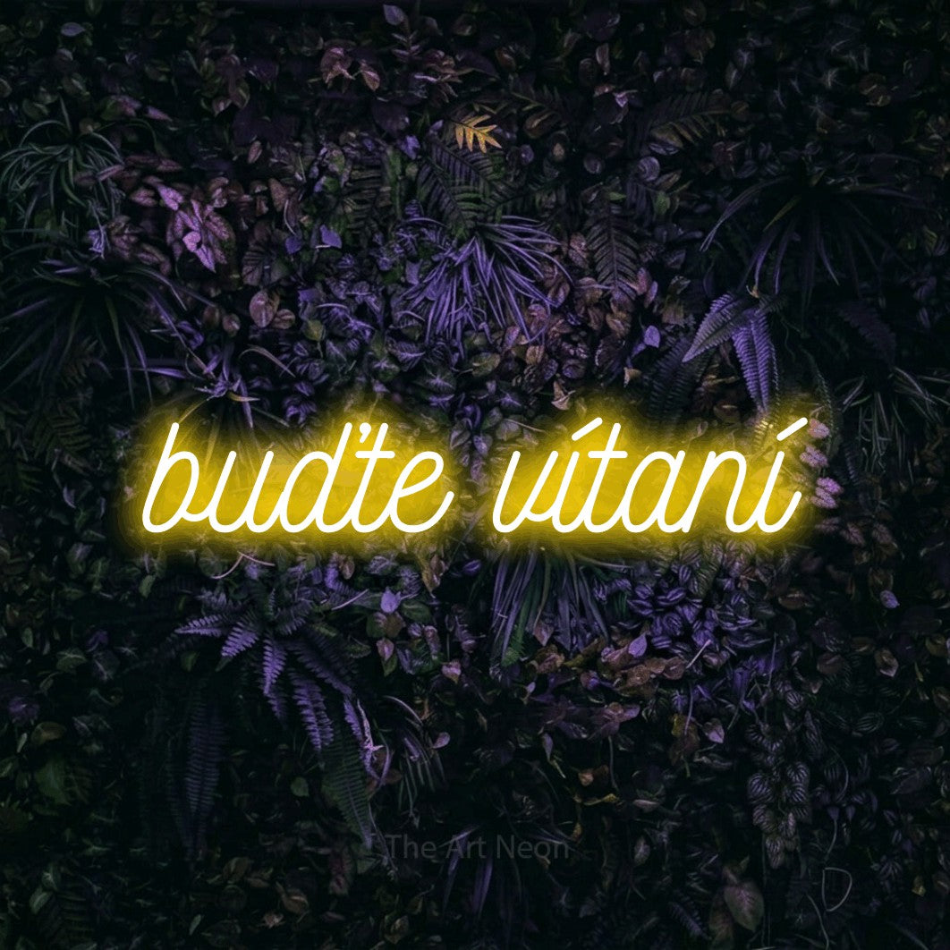 LED neon sign reading “buďte vítaní”, arranged in a single line.