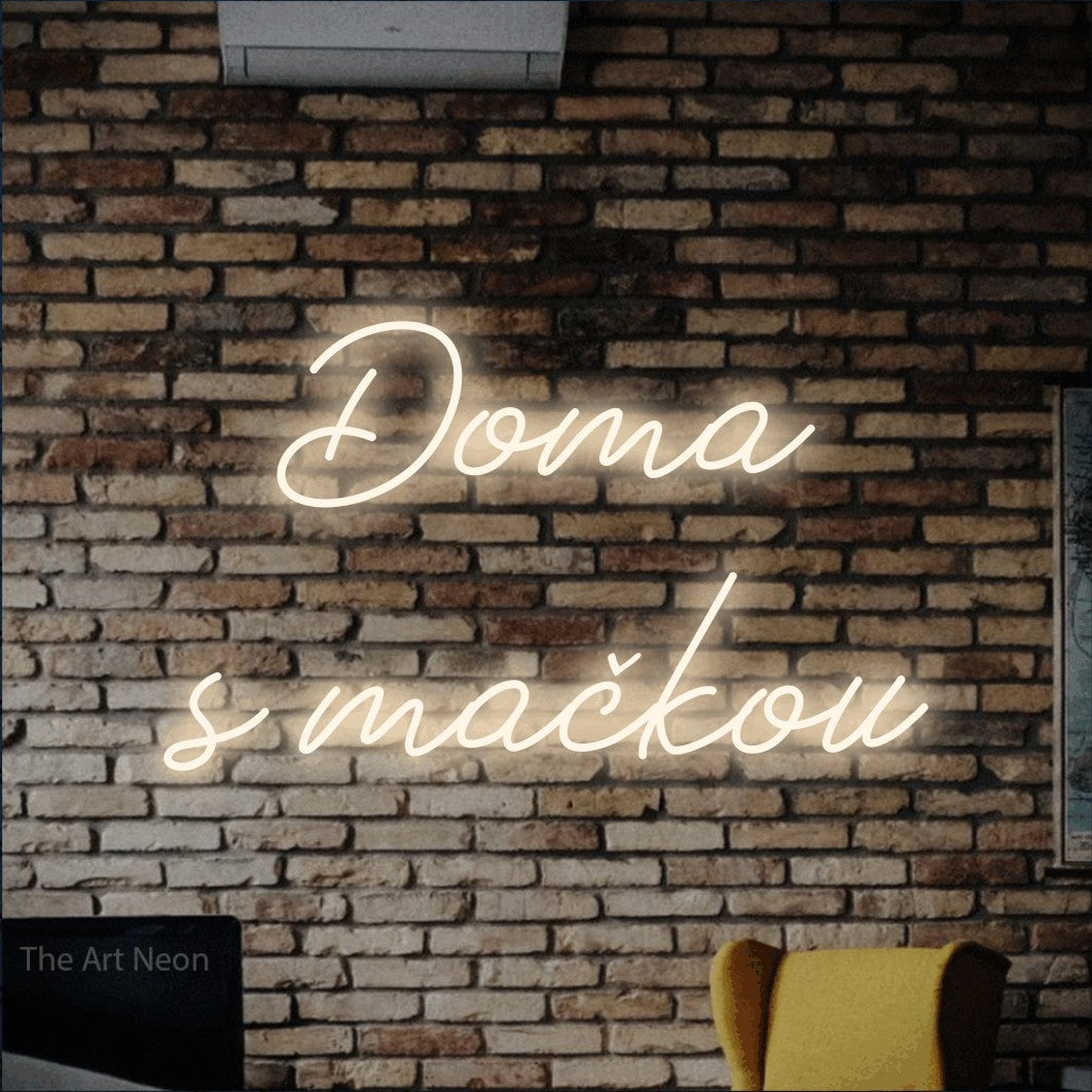 LED neon sign reading “Doma s mačkou”, arranged in two lines.