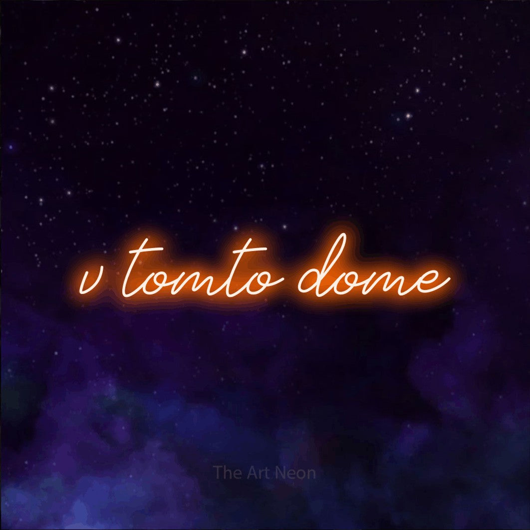 LED neon sign reading “v tomto dome”, arranged in a single line.