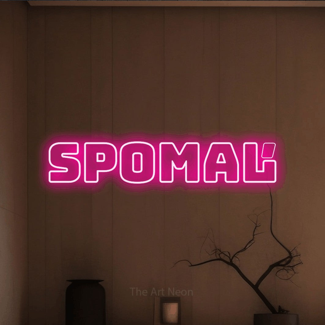 LED neon sign reading “Spomaľ”, arranged in a single line.
