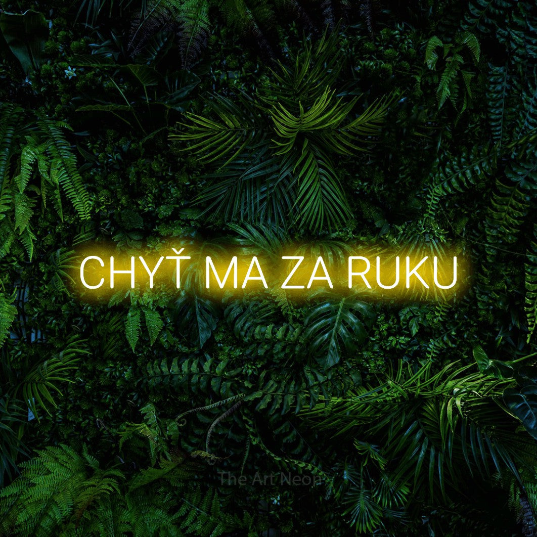 LED neon sign reading “CHYŤ MA ZA RUKU”, arranged in a single line.