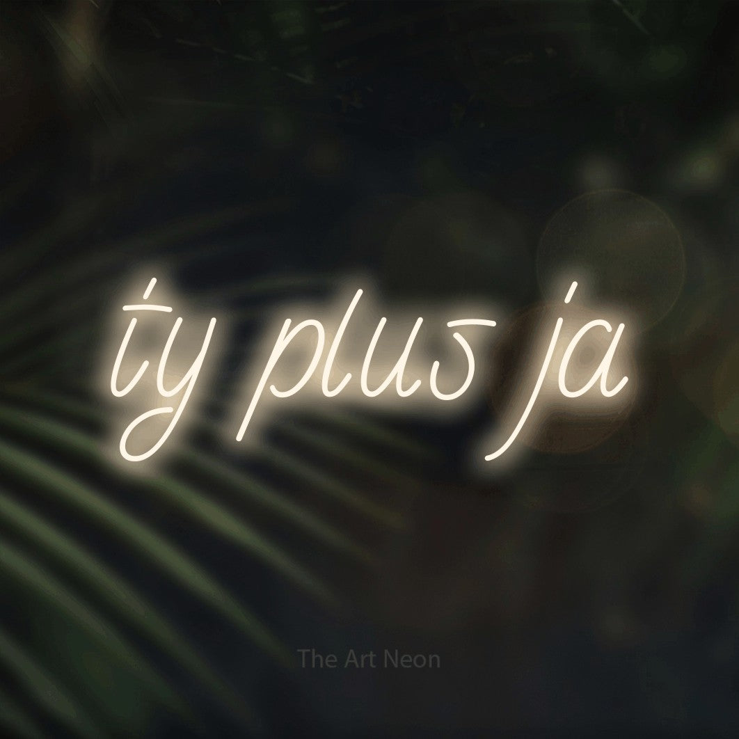 LED neon sign reading “ty plus ja”, arranged in a single line.