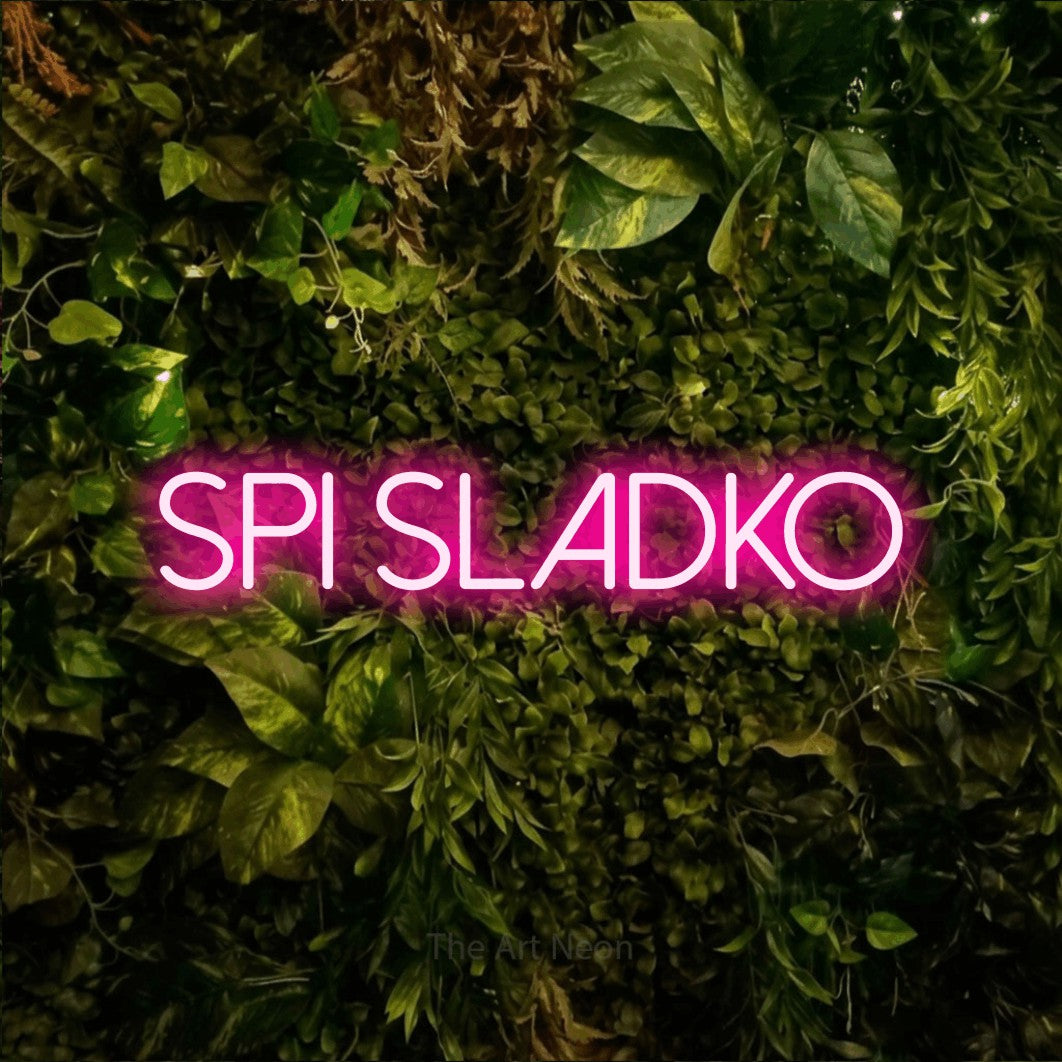 LED neon sign reading “SPI SLADKO”, arranged in a single line.