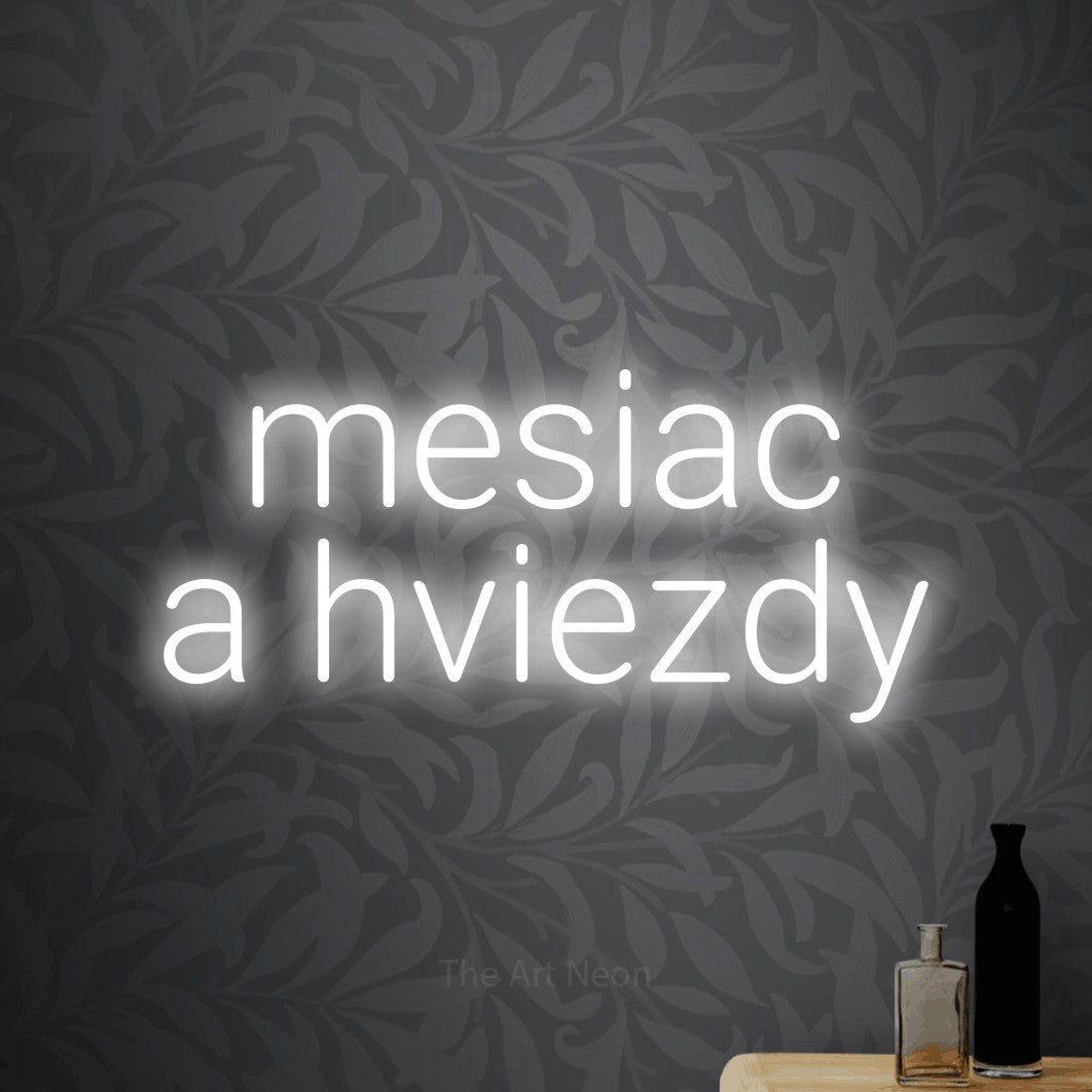 LED neon sign reading “mesiac a hviezdy”, arranged in two lines.