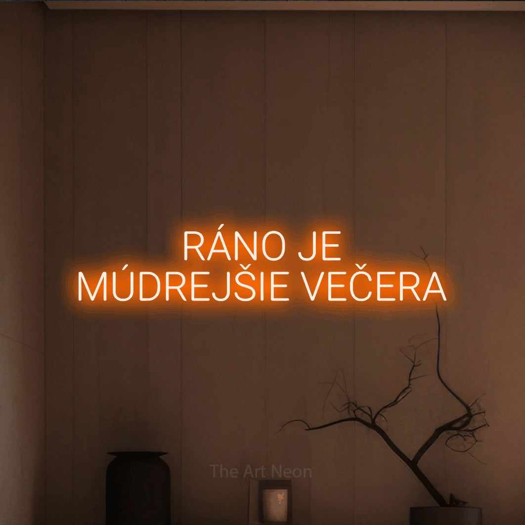 LED neon sign reading “RÁNO JE MÚDREJŠIE VEČERA”, arranged in two lines.