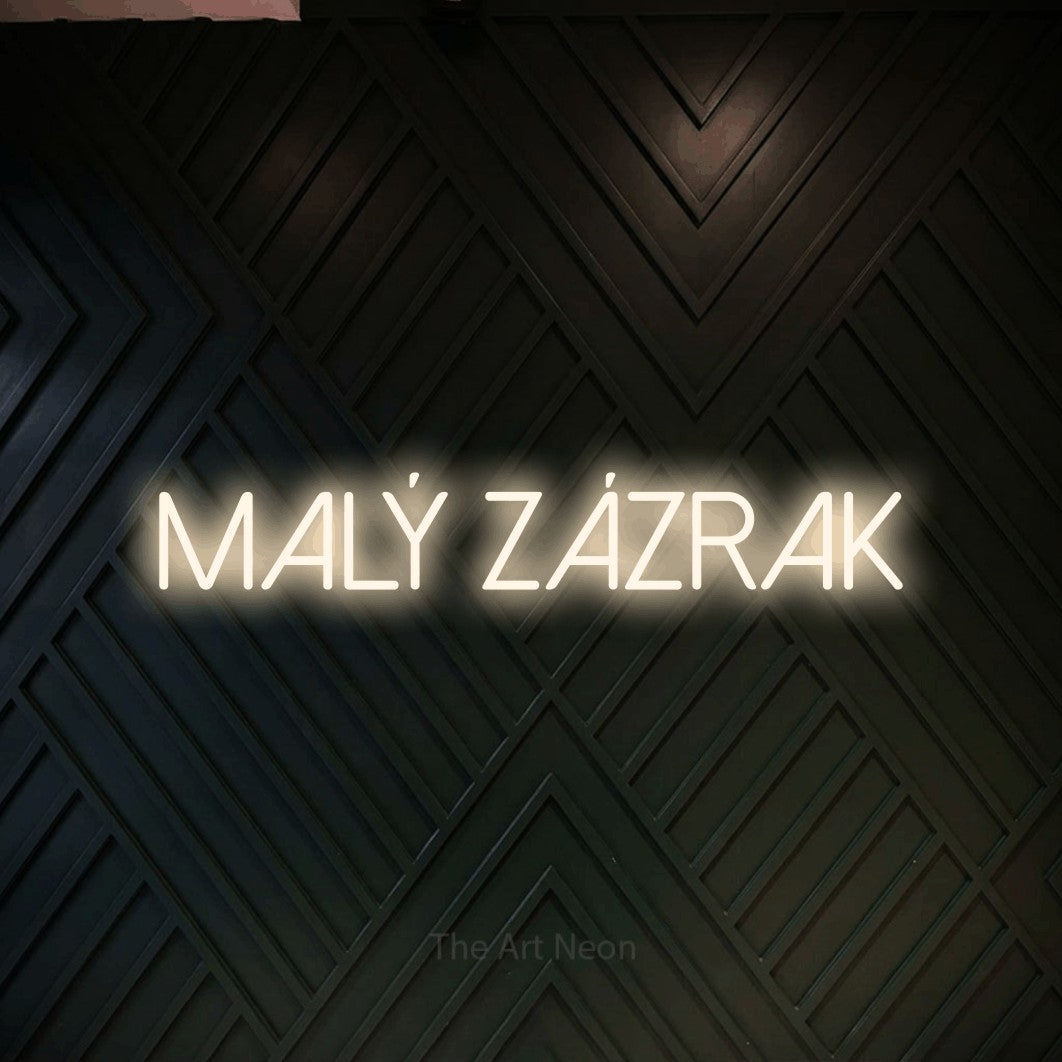 LED neon sign reading “Malý Zázrak”, arranged in a single line.