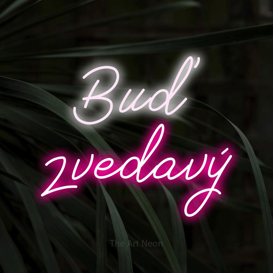 LED neon sign reading “Buď zvedavý”, arranged in two lines.
