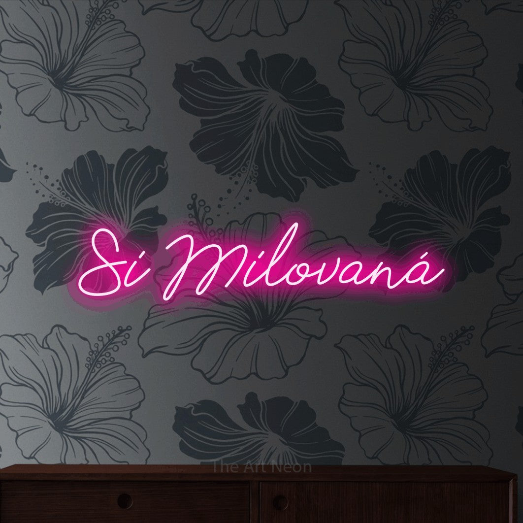 LED neon sign reading “Si Milovaná”, arranged in a single line.