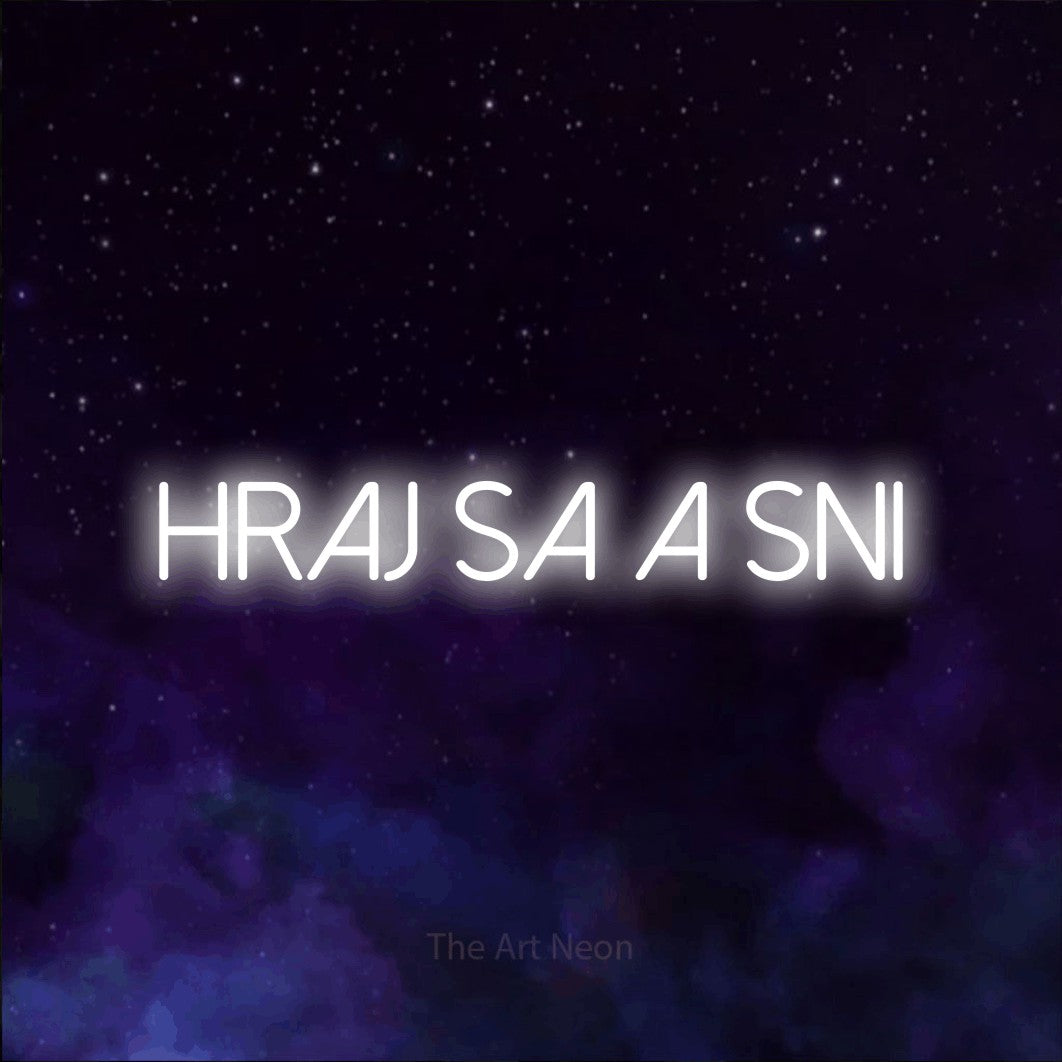 LED neon sign reading “hraj sa a sni”, arranged in a single line.