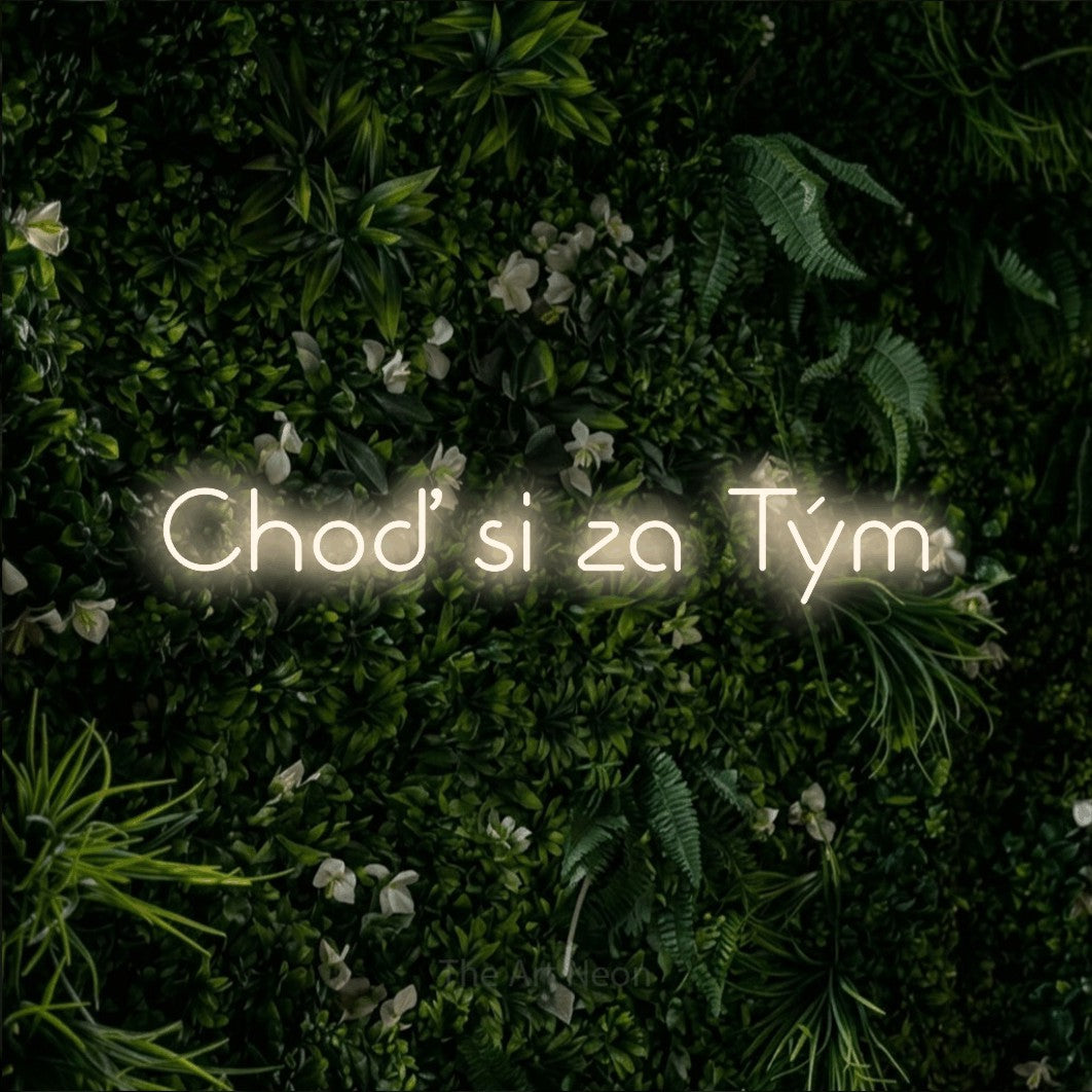 LED neon sign reading “Choď si za Tým”, arranged in a single line.