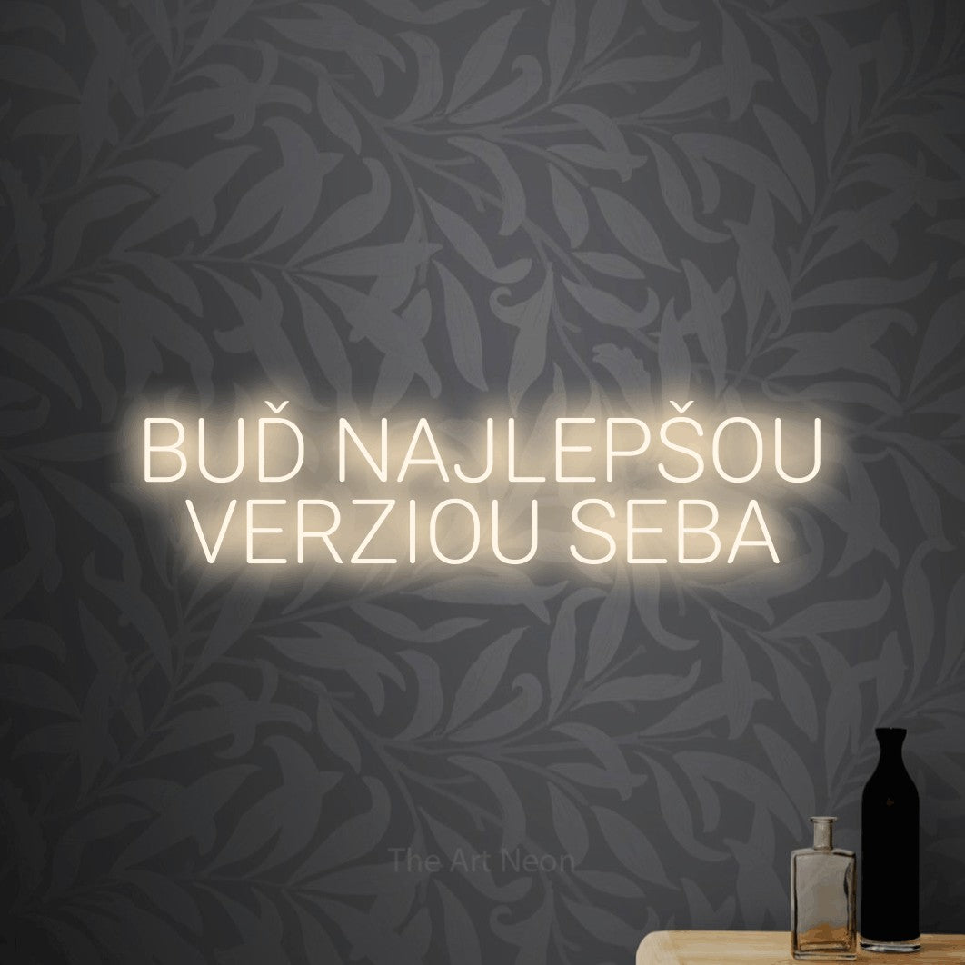 LED neon sign reading “BUĎ NAJLEPŠOU VERZIOU SEBA”, arranged in two lines.