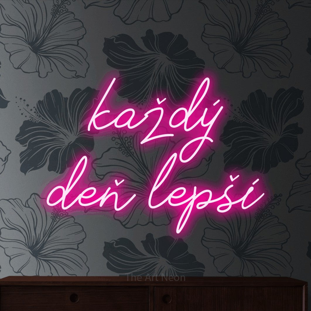 LED neon sign reading “každý deň lepší”, arranged in two lines.